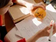 Man writing exam notes
